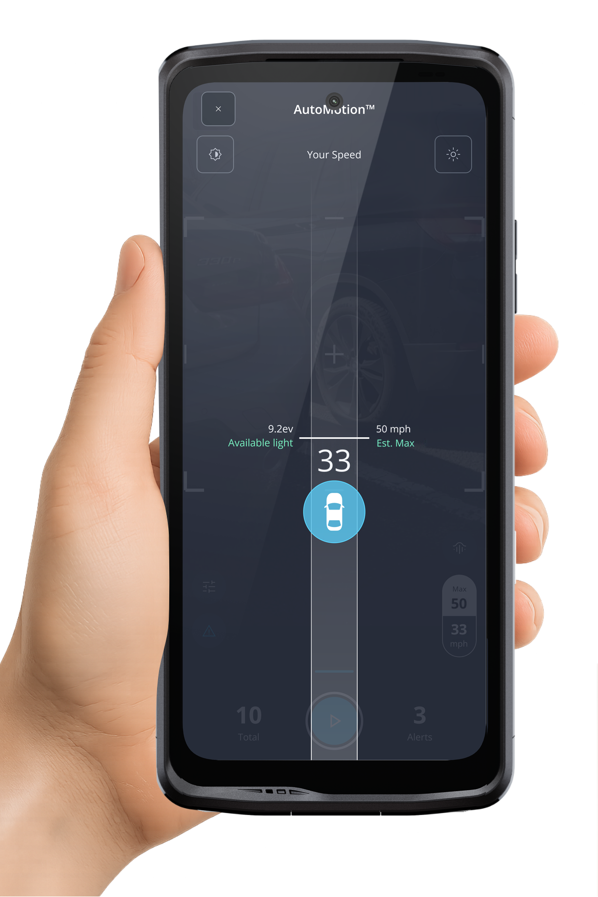 A phone in hand running AutoMotion, showing the available light and the fastest speed it can read at, beside a second phone on its side showing the reads list