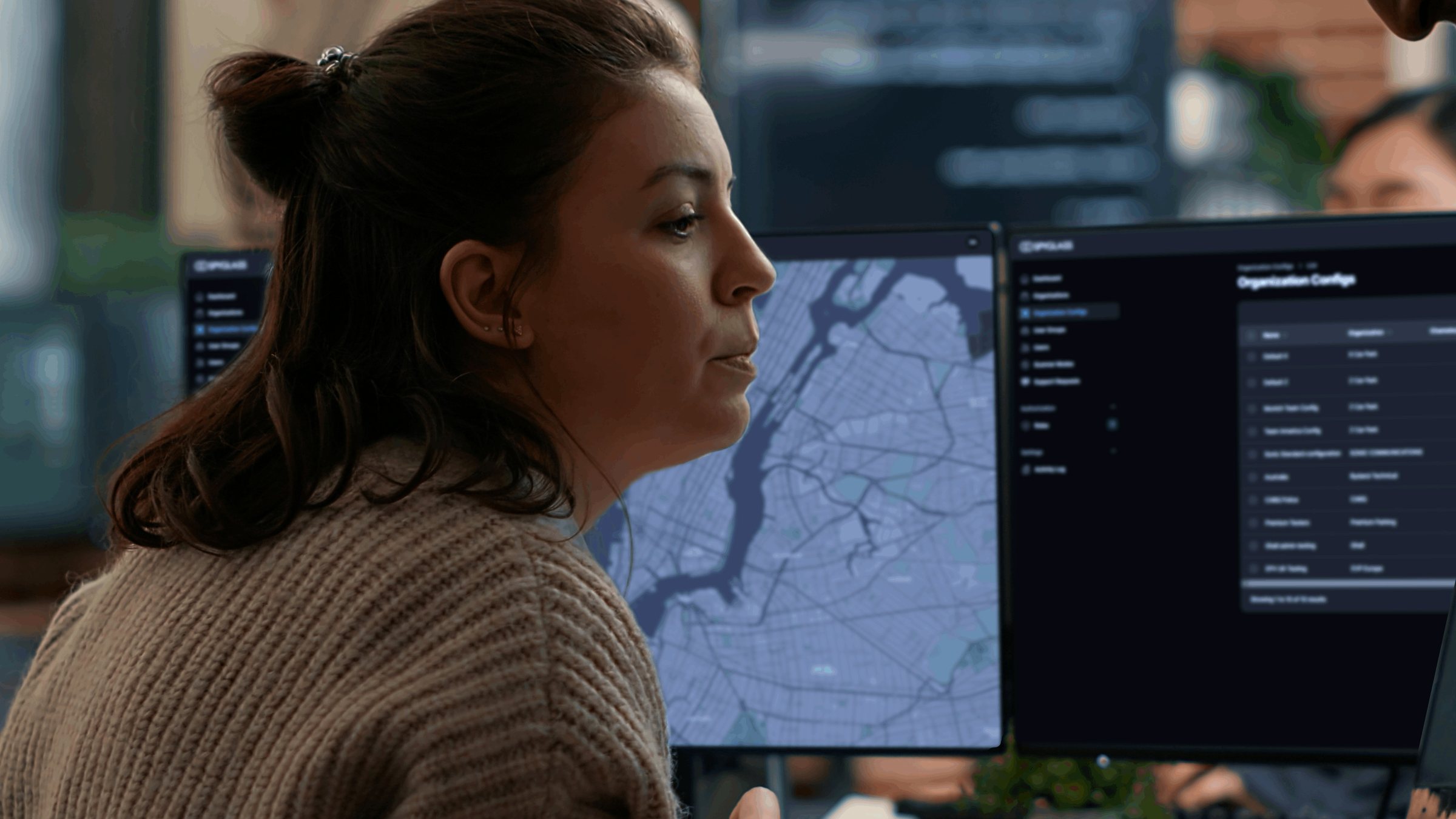 An analyst at her desk, the Trellis map on the monitor in front of her